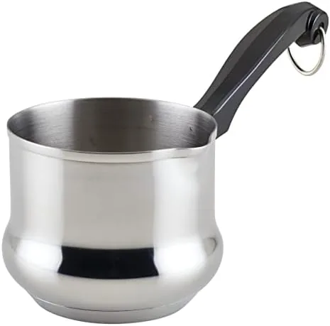 The Farberware Classic butter warmer sitting on a stovetop with butter melting inside