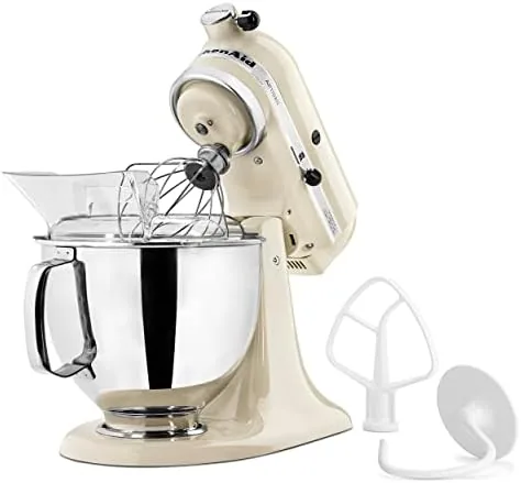 The KitchenAid Artisan whipping cream in the stainless steel bowl
