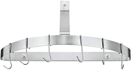The Cuisinart half-circle wall pot rack mounted on a kitchen wall with cookware