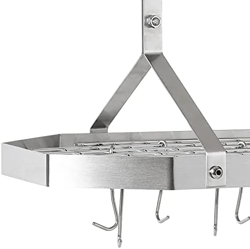 Reaching up to hang a stockpot on the octagonal ceiling rack during use