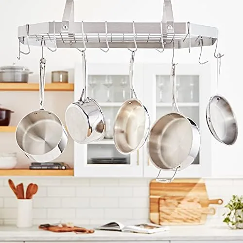 A kitchen island with the octagonal rack overhead holding the daily cookware
