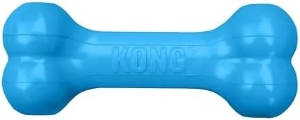 The blue KONG Puppy Goodie Bone sitting on a play rug