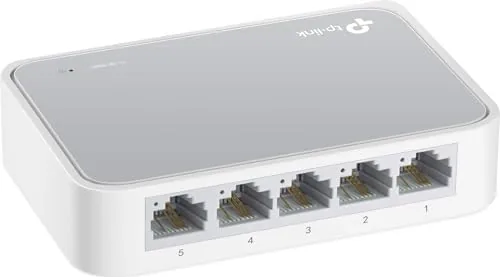 The TP-Link TL-SF1005D switch on a desk with Ethernet cables connected