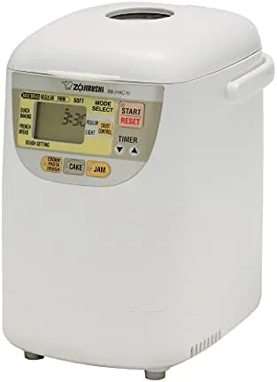 Open lid of the Zojirushi breadmaker showing the nonstick pan and kneader