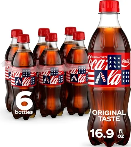 A cold 16.9 ounce Coca Cola bottle with condensation ready to be opened