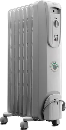 The DeLonghi EW7707CM oil filled radiator in a corner of a bedroom