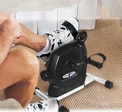 Close view of the DeskCycle pedal and resistance dial