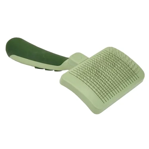 The Coastal Pet Safari self-cleaning slicker brush in a hand