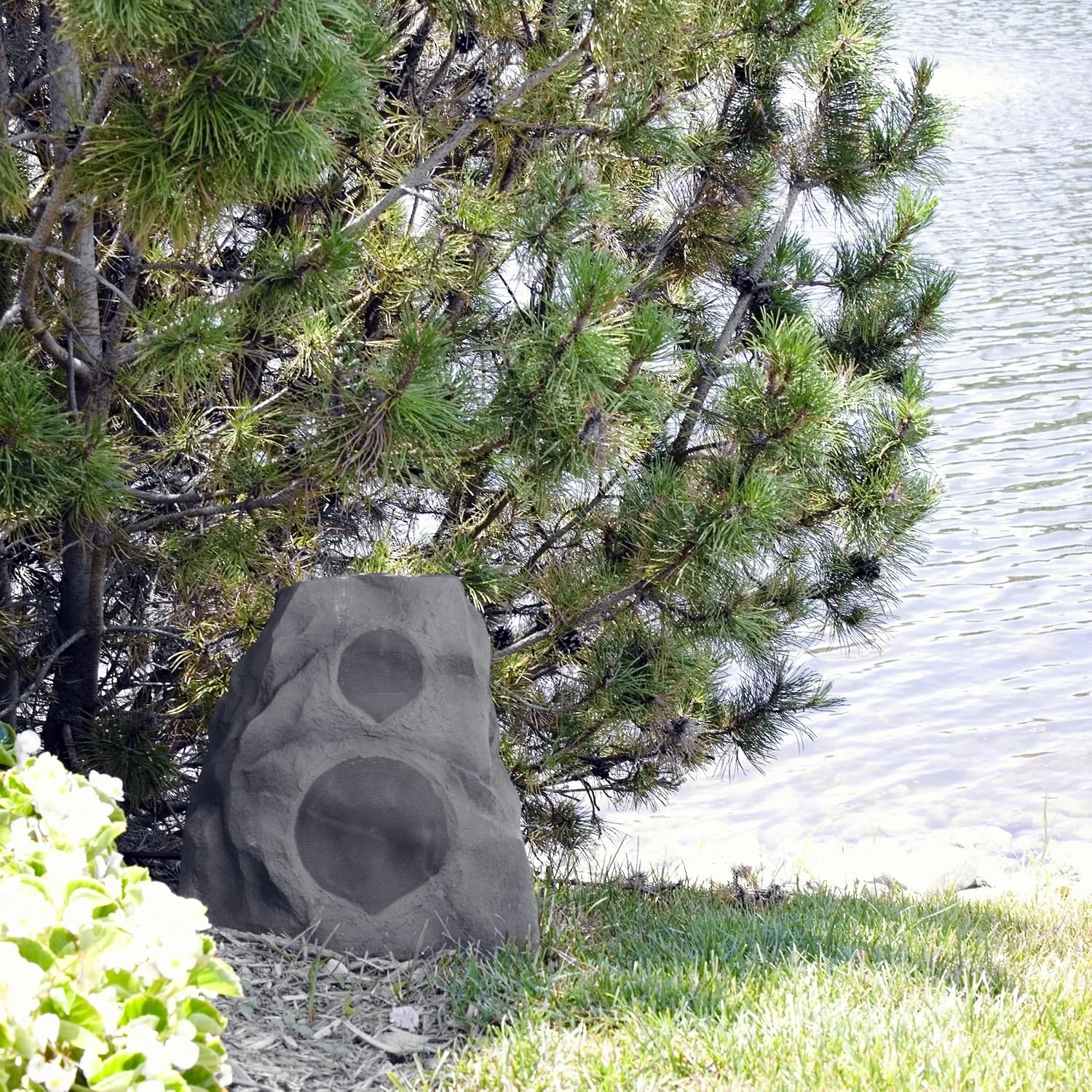 The Klipsch AWR-650-SM mounted high on a covered patio wall beside a doorway