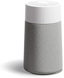 The Blueair Mini Max air purifier on a bedroom nightstand