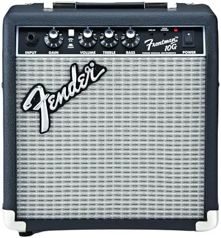 The Fender Frontman 10G amp sitting on a bedroom desk with a guitar nearby