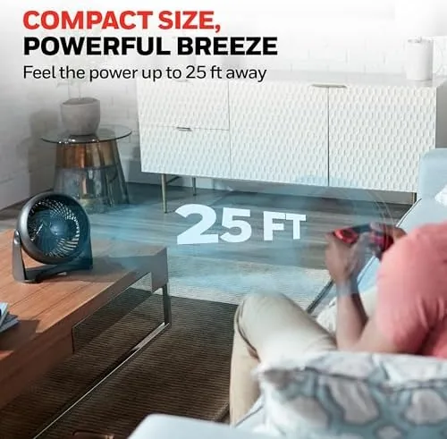 The HT900 on a side table blowing across a couch toward a person reading