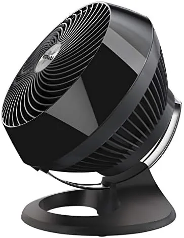 The Vornado 660 standing upright on a floor in a bedroom