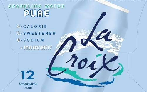 Glass of La Croix Pure sparkling water with lemon wedge at a meal