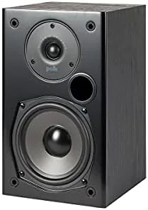 Polk T15 speakers playing music with a person adjusting the amplifier