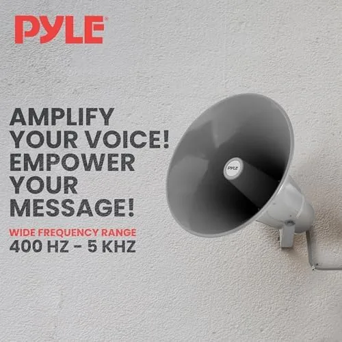 Two Pyle horn speakers mounted at opposite ends of a workshop
