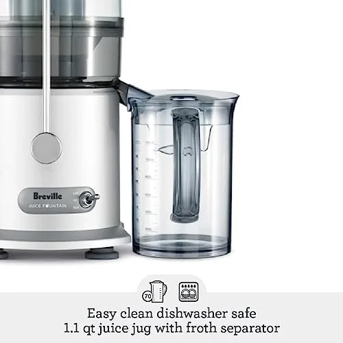 Two glasses of freshly made juice next to the pulp container of the juicer