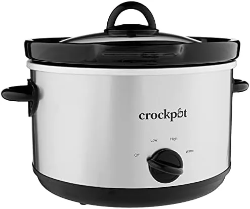 The removable stoneware insert lifted out of the slow cooker