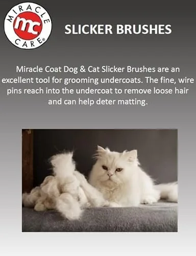 Person grooming a relaxed long haired cat with the Miracle delight slicker