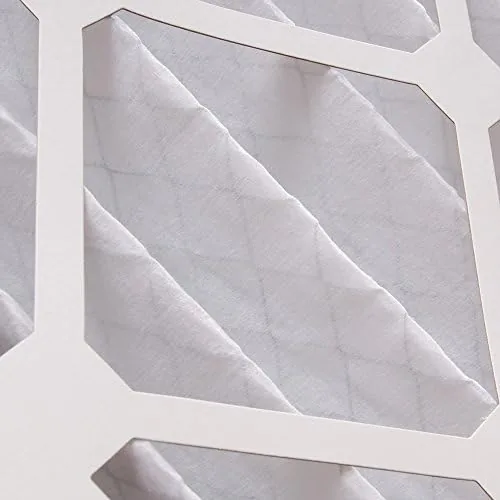 Three HVAC filters compared side by side on a workbench