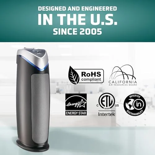 Air purifier running in a home office next to a desk