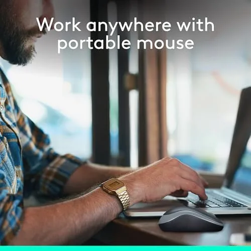 Hand using the Logitech M185 on a laptop in a relaxed home office