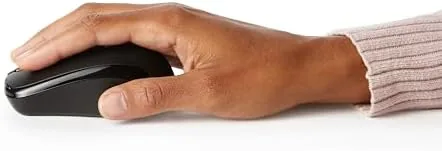 The wireless mouse in active use controlling a cursor on a laptop screen
