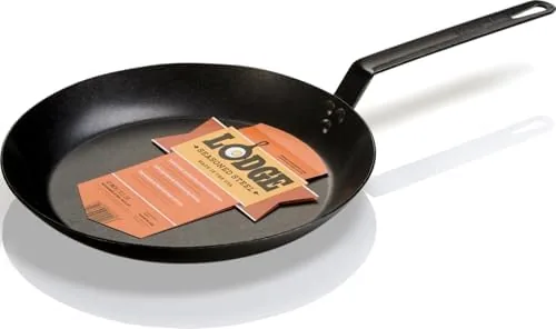The Lodge 12 inch carbon steel skillet hanging on a kitchen wall rack