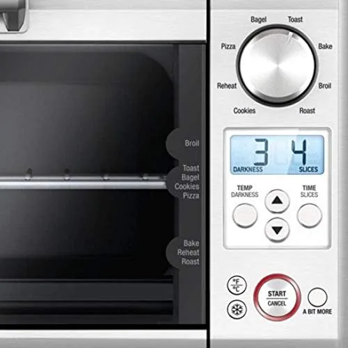 Slices of bread toasting inside the Breville mini oven through the glass door
