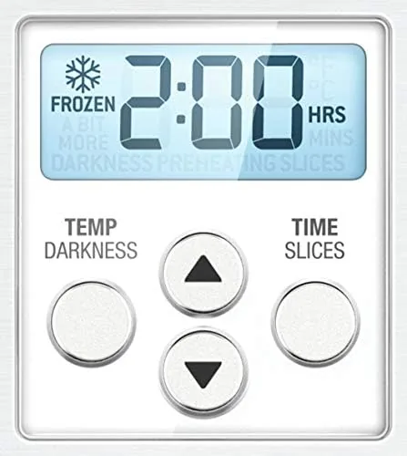 A small baked cake cooling on a rack with the Breville oven in the background