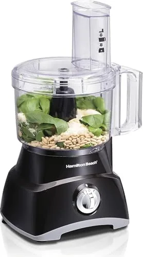 The Hamilton Beach 8 cup food processor sitting on a kitchen counter with the bowl attached