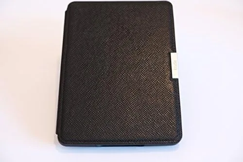 The Kindle open on a lap in a bright reading chair