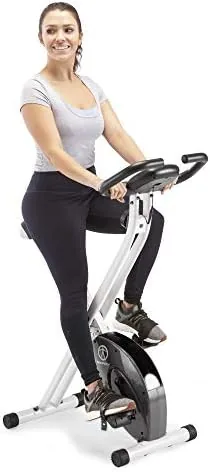 The Marcy upright exercise bike fully set up in a small home room