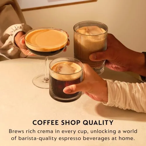 Someone preparing a capsule in a home espresso machine in the morning
