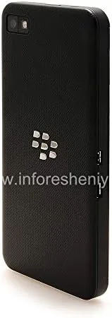 The Z10 resting on a desk beside a pair of headphones as a secondary device
