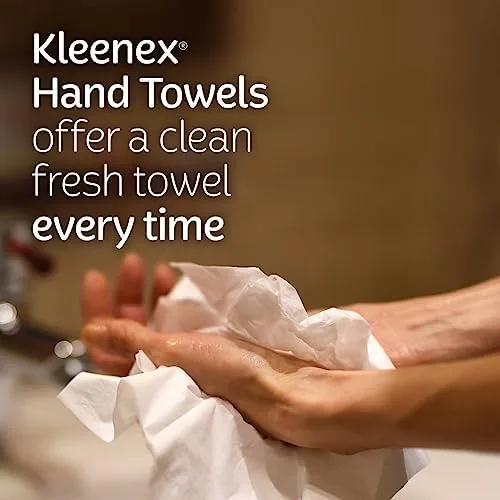 A Kleenex towel box beside a cloth towel and a paper roll for comparison
