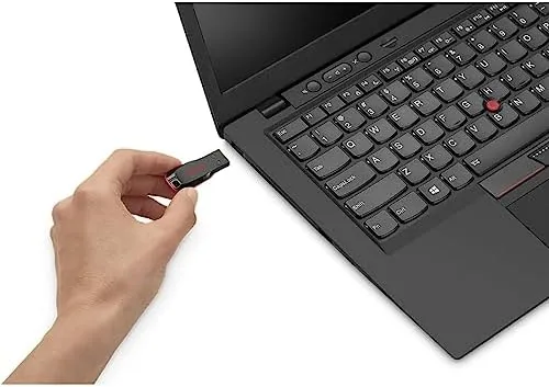 Photo files being transferred from a computer onto the flash drive