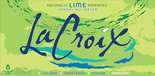Pouring La Croix lime sparkling water into a glass with ice