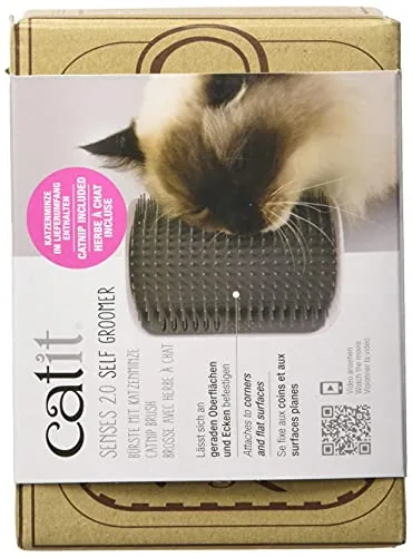 The Catit self groomer compared side by side with a handheld shedding comb
