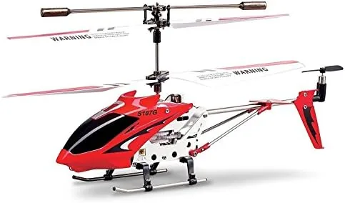 The red Syma S107G mini helicopter resting on a table
