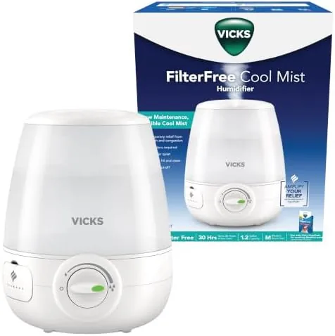 The Vicks filter-free ultrasonic humidifier on a bedroom nightstand