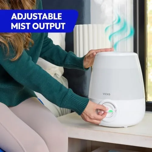 A child sleeping peacefully in a bedroom with the humidifier running