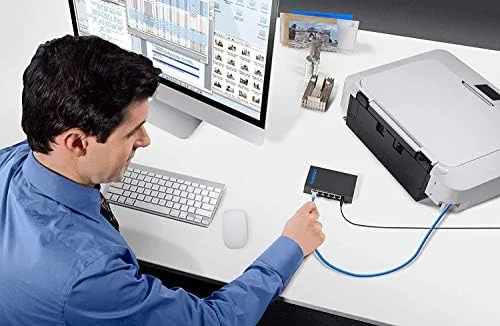 Switch in use with transfer speeds shown on a laptop screen