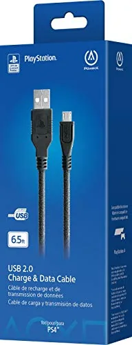 The PowerA USB charging cable coiled on a table next to a PlayStation controller