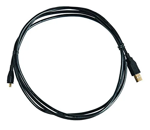 A PlayStation controller charging through the PowerA cable on a shelf