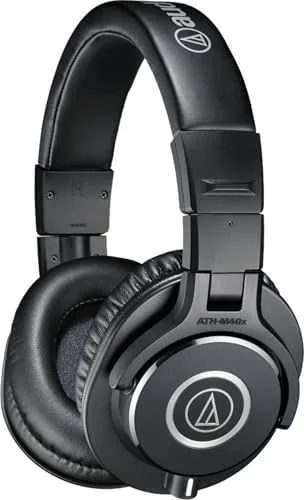 The Audio-Technica ATH-M40x resting flat on a wooden desk