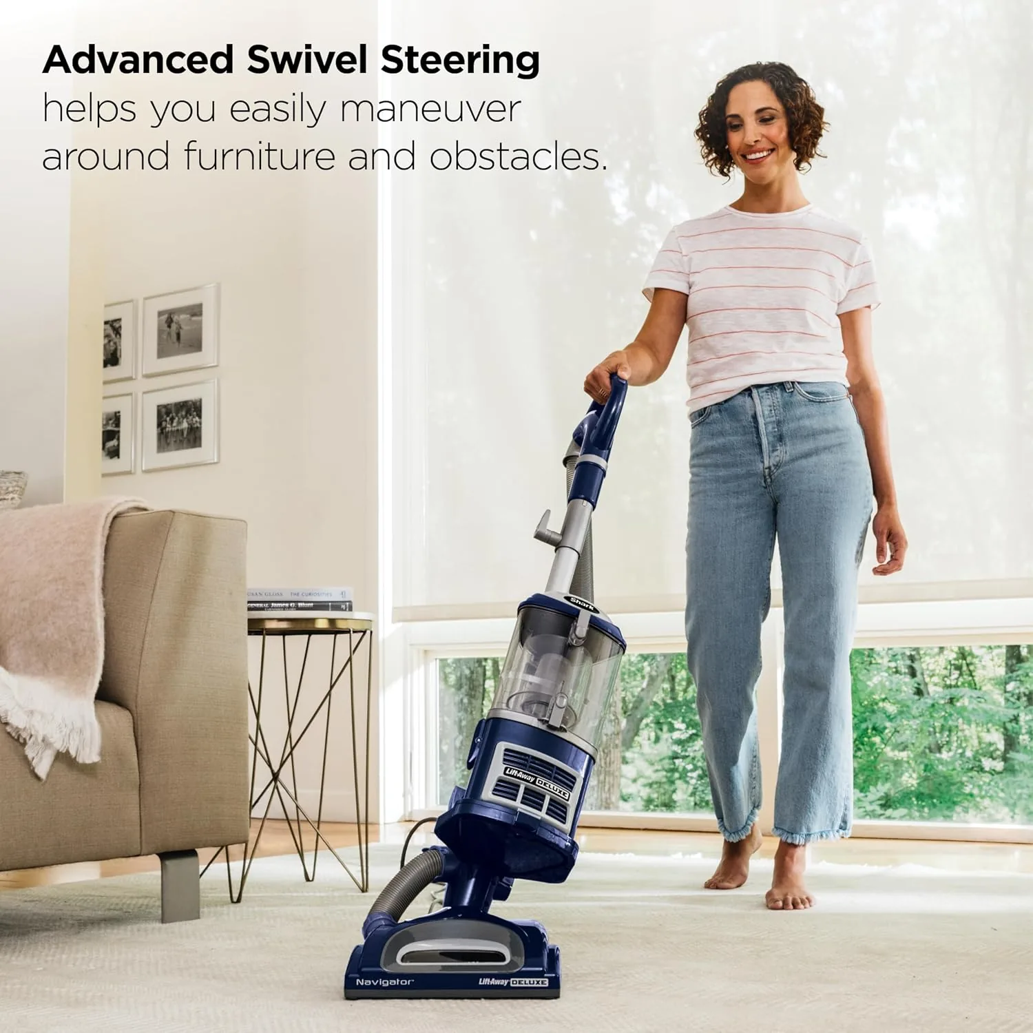 The NV360 beside a cordless stick vacuum and a premium Shark upright