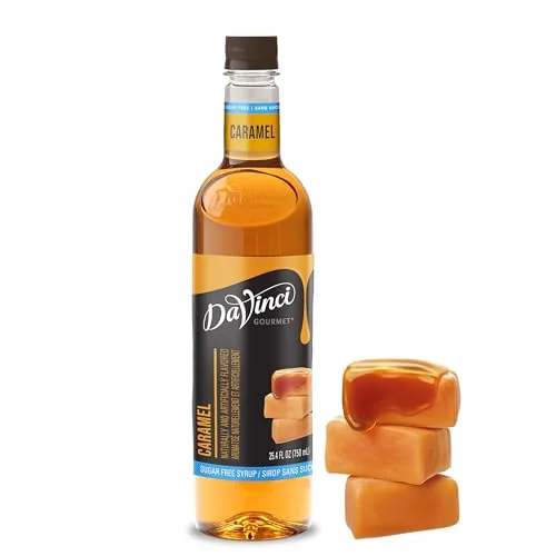 DaVinci Gourmet sugar-free caramel syrup bottle with a spout beside a mug of coffee