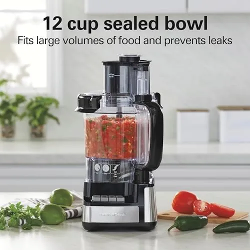The reversible slicing and shredding disc and stainless steel blade on a counter