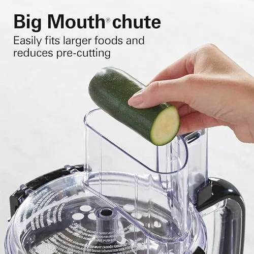 Cabbage shredding into a large bowl through the feed tube